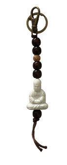 Witte Shakyamuni Boeddha sleutelhanger in meditatiehouding