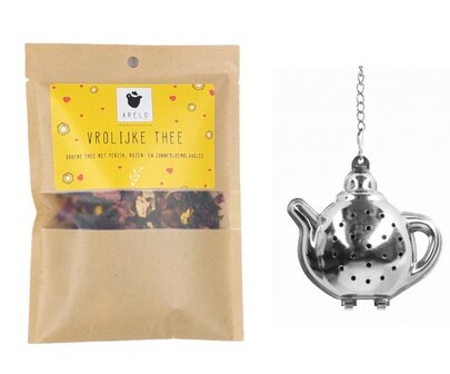 Theepakketje met vrolijke groene thee en theepot thee-ei in geschenkverpakking