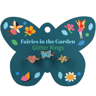 Drie goudkleurige verstelbare kinderringetjes op een kleurrijke giftcard.