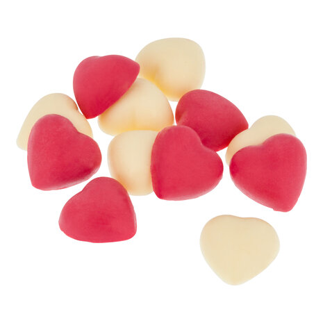Losse roze en witte hartjes van chocolade