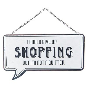 Metalen tekstbord met de quote I could give up shopping but I'm not a quitter.
