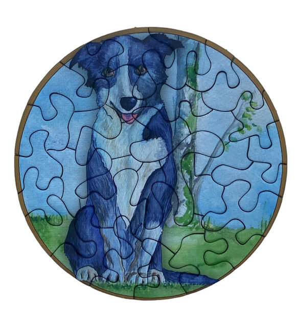 Art ronde puzzel met afbeelding van een hond en 33 stukjes.