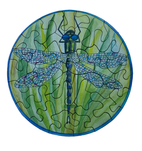 Mini puzzel rond 8,5 cm met afbeelding van een libelle.