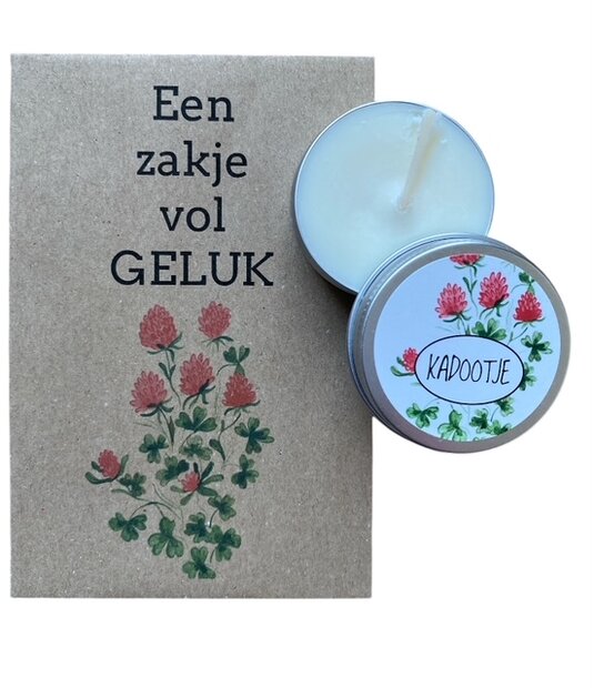 Handgegoten kaarsje kadootje van 5 cm naast het zakje vol geluk