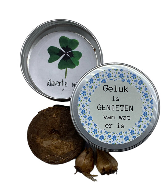 Zaden blikje met tekst "Geluk is genieten van wat er is"