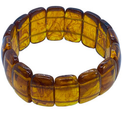 Armband barnsteen oranje geregen op elastiek in luxe organzazakje