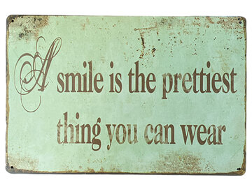 Metalen bord A smile is... Metalen bord A smile is...